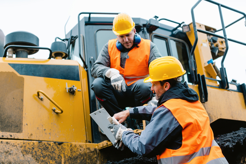 Worker,Sitting,On,Heavy,Excavation,Machinery,In,Mining,Operation